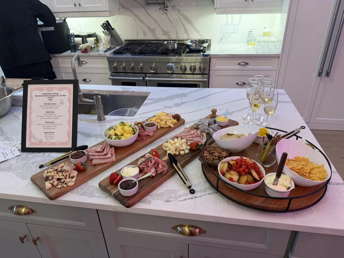 Charcuterie boards laid out along a kitchen island