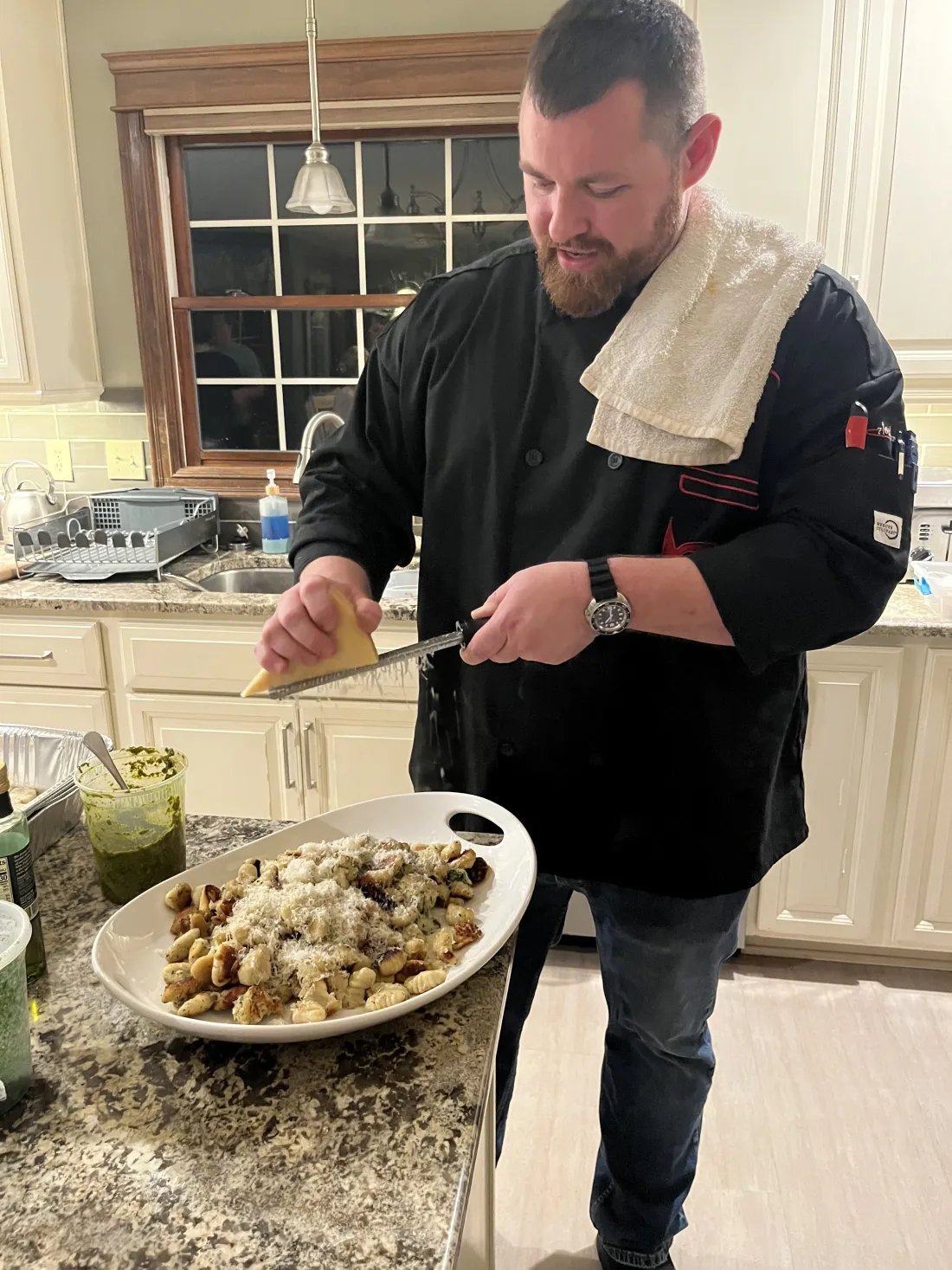 Chef Michael in a client kitchen with a plated dish